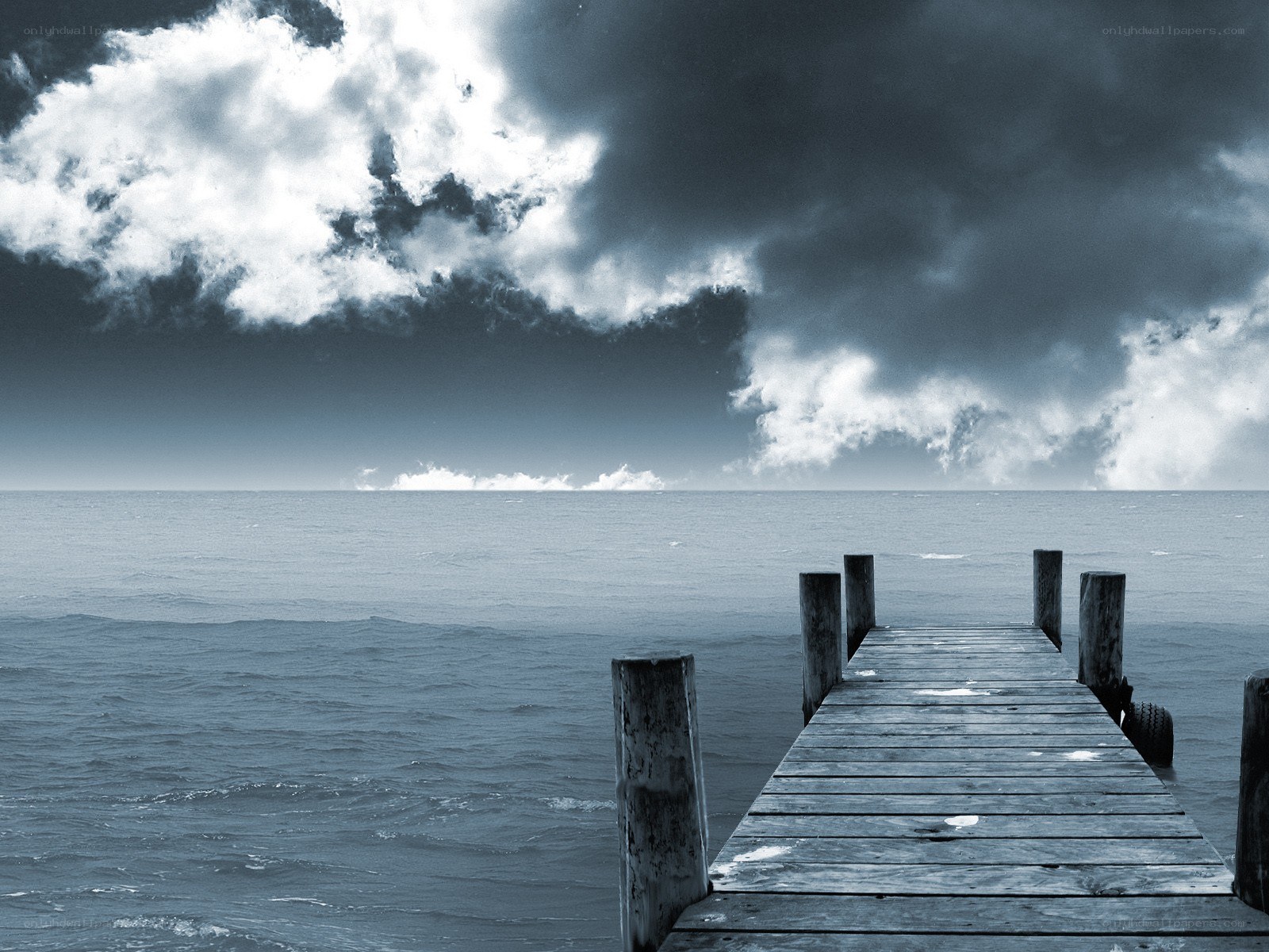 Stormy sky over wooden pier