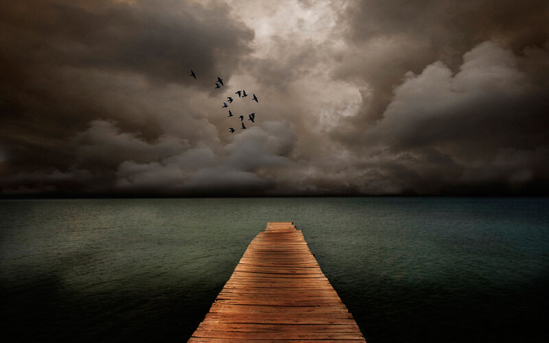 Stormy sky over wooden pier
