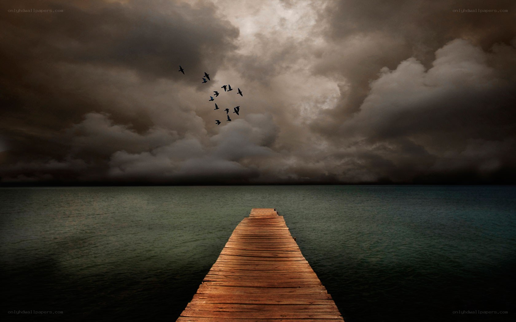 Stormy sky over wooden pier