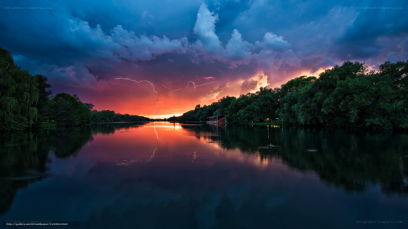 Stormy sunset over a calm lake