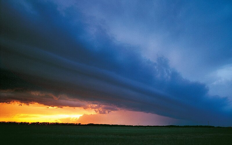 Stormy sunset over a field