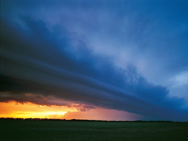 Stormy sunset over a field