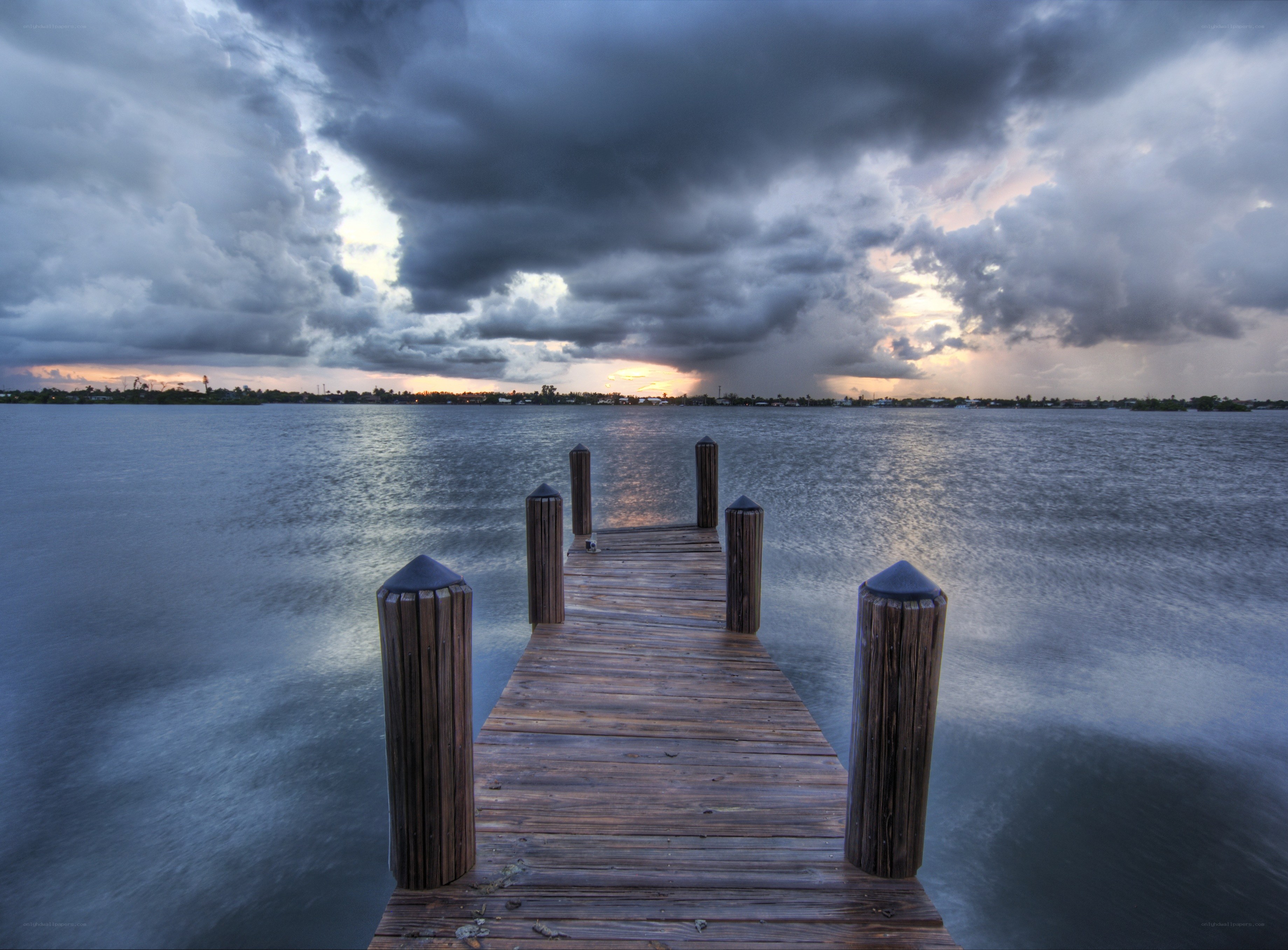 Stormy sunset over a wooden pier