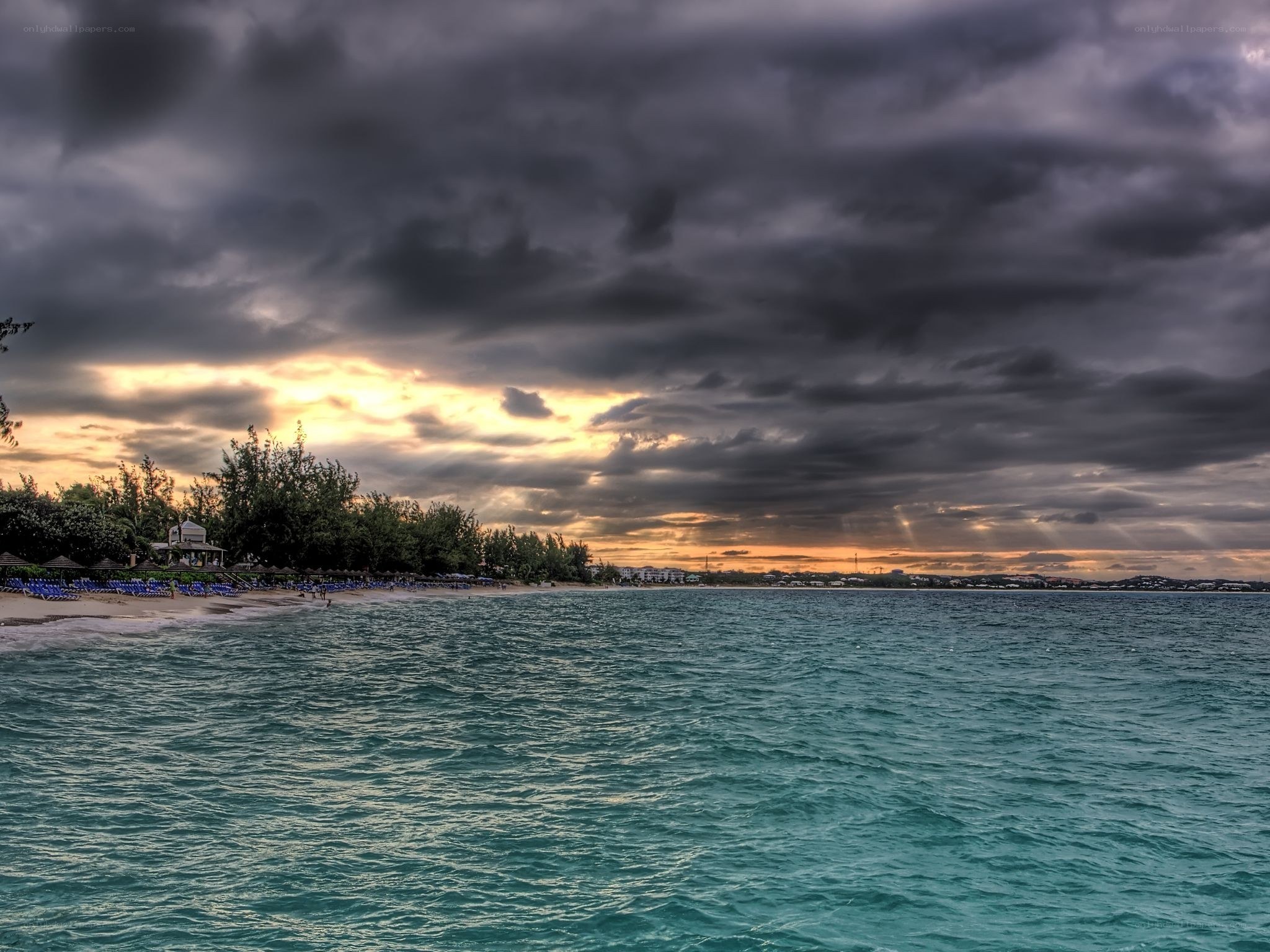 Stormy sunset over tropical beach