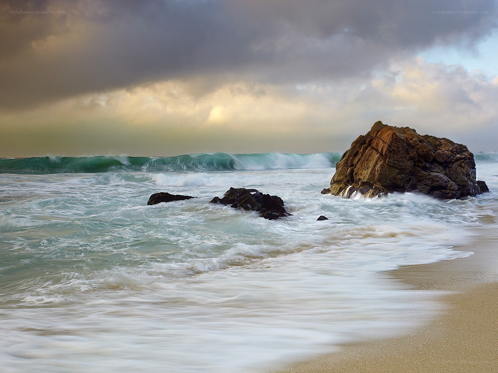 Stormy waves at rocky beach