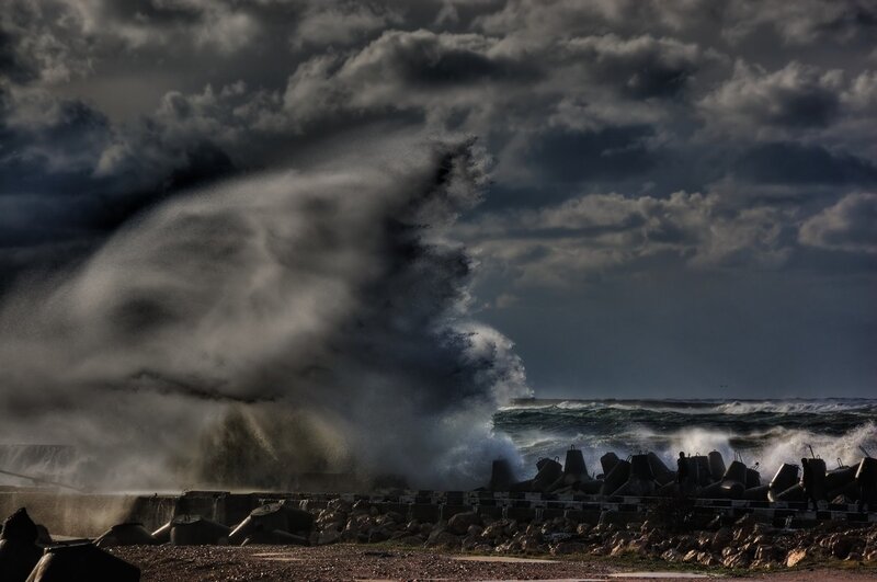 Stormy waves crash on breakwater