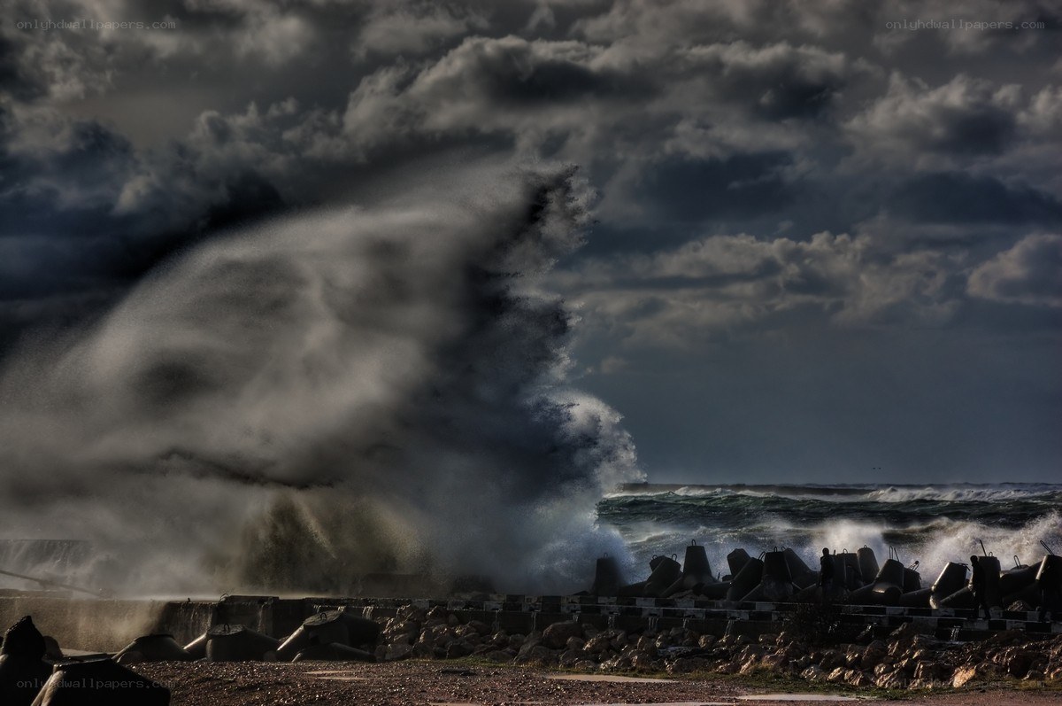 Stormy waves crash on breakwater