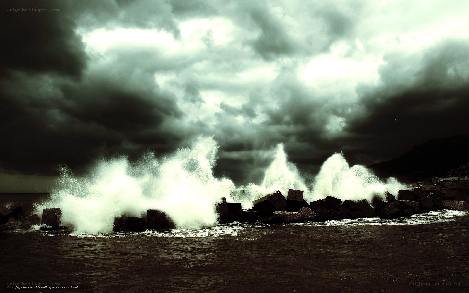 Stormy waves crash on breakwater