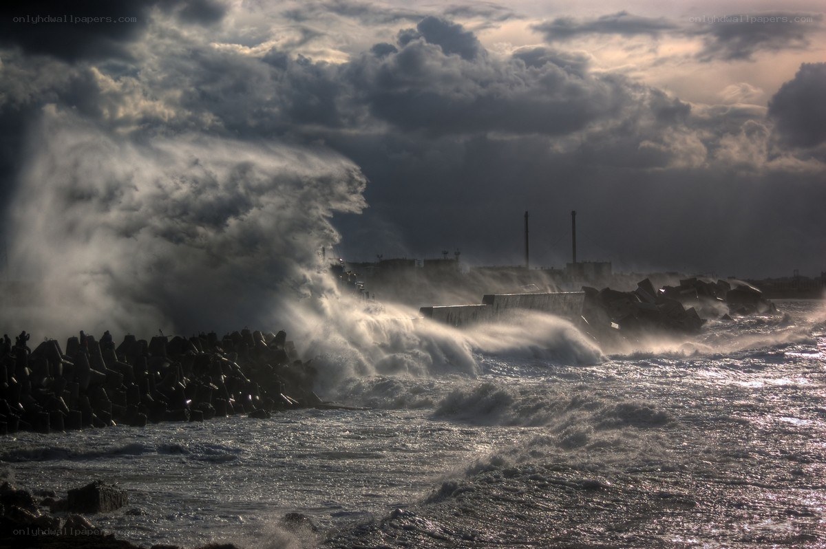 Stormy waves crash on breakwaters