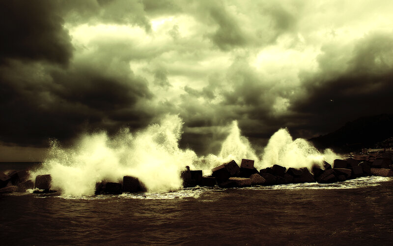 Stormy waves crash on breakwaters