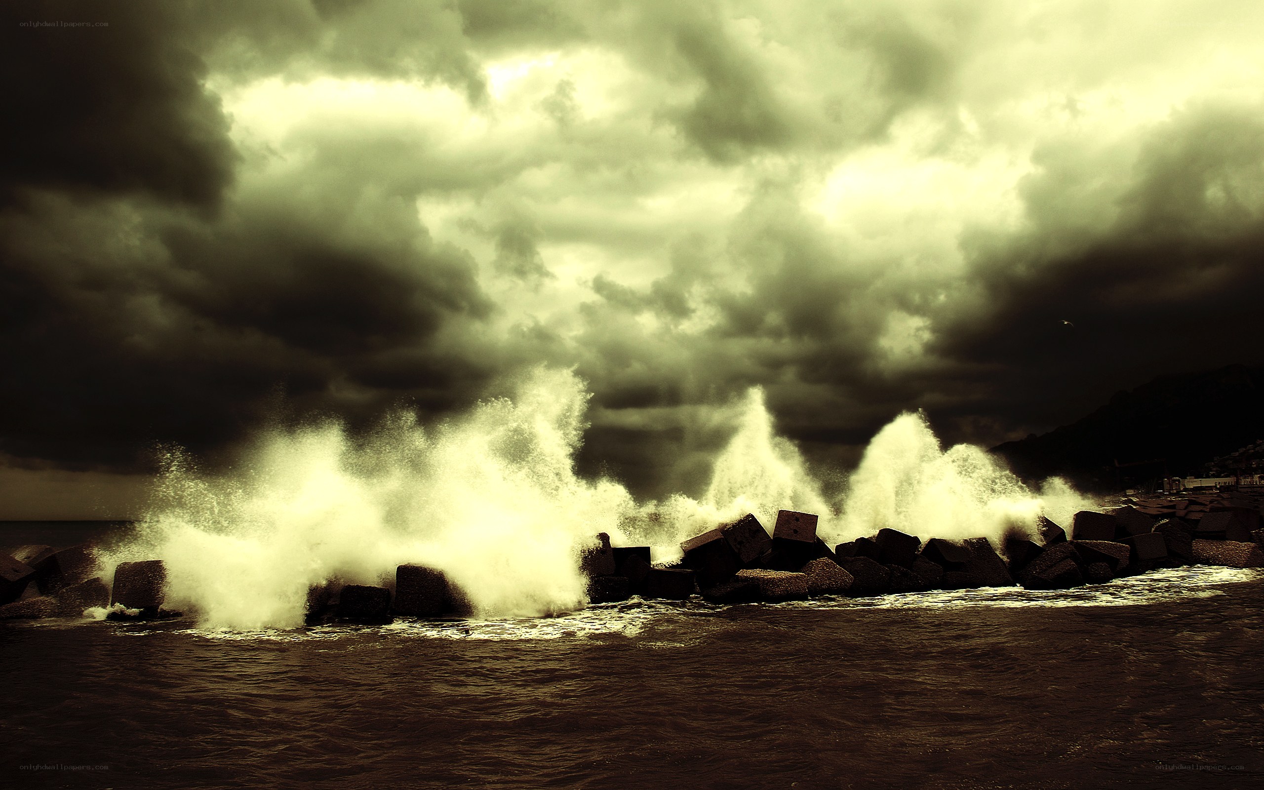 Stormy waves crash on breakwaters