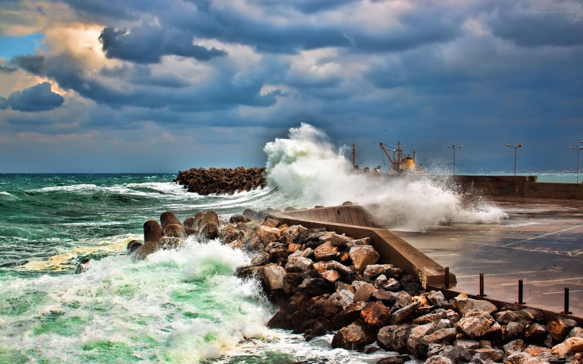Stormy waves crash on harbor