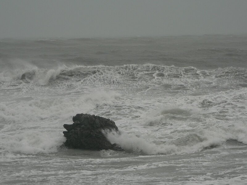 Stormy waves crash on rocks