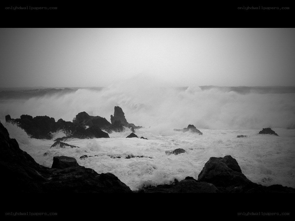 Stormy waves crash on rocks