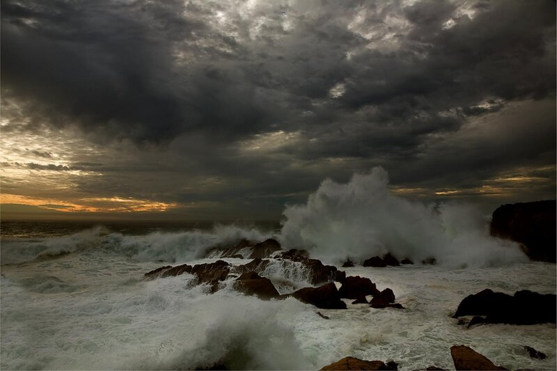 Stormy waves crash on rocks