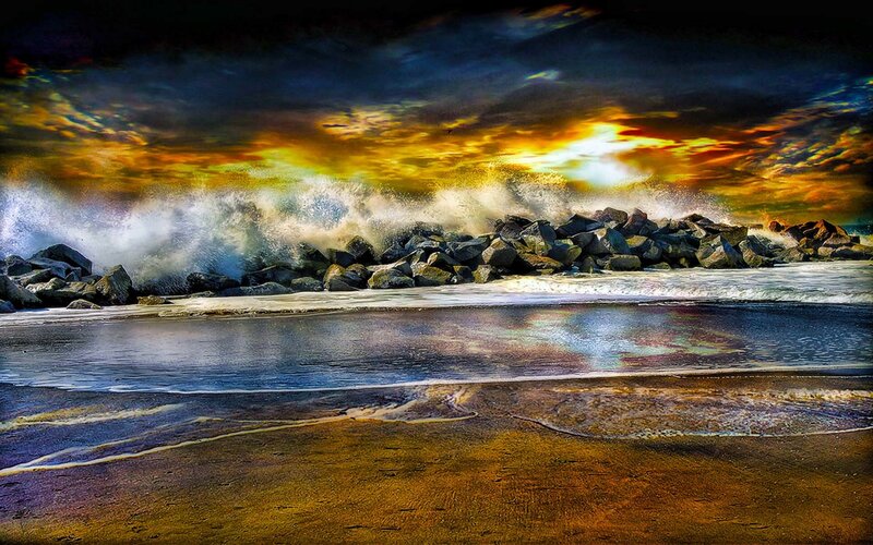 Stormy waves crash on rocky shore