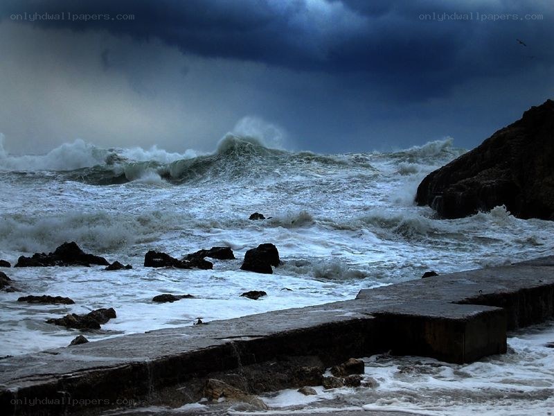 Stormy waves crashing on rocks