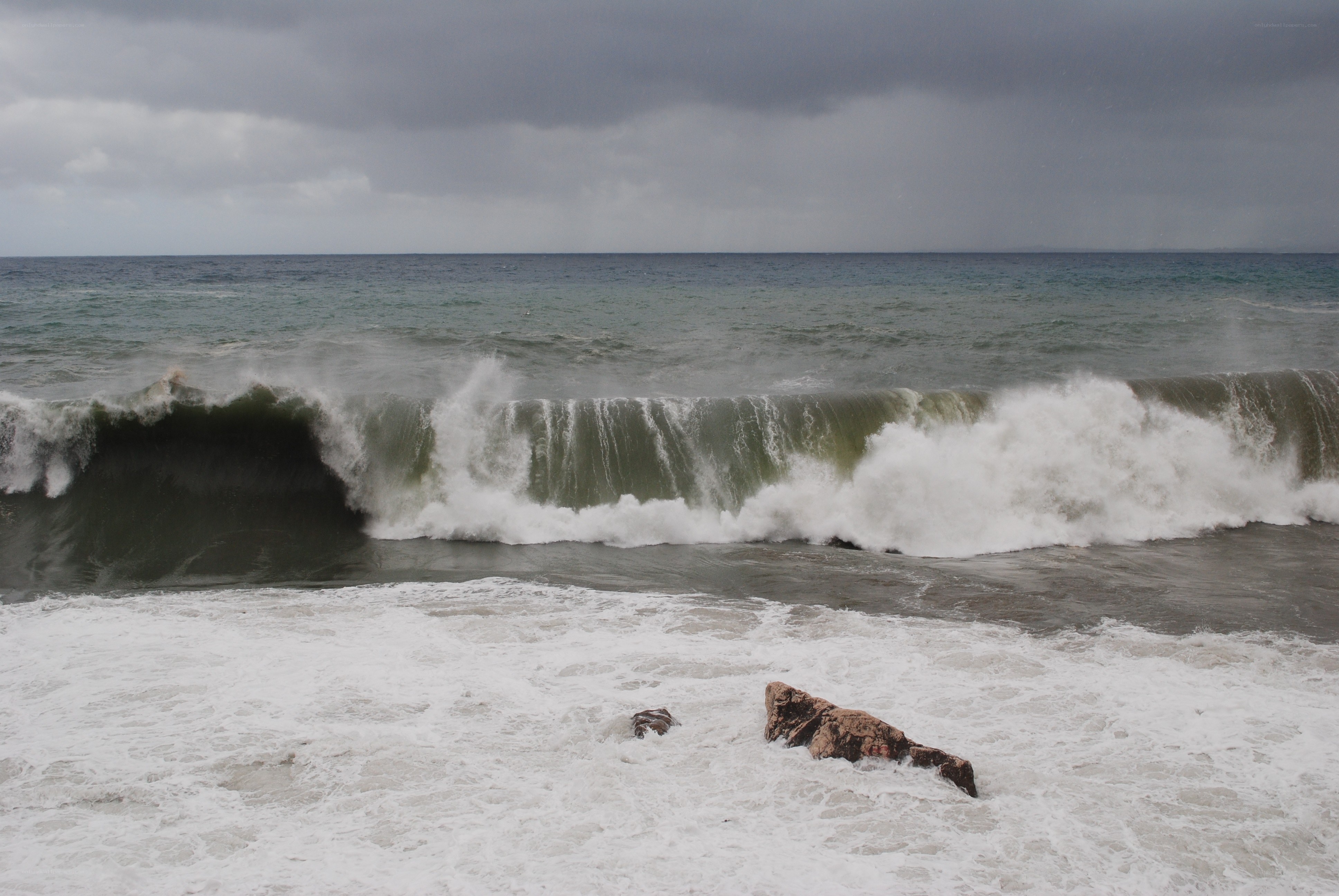 stormy waves crashing on shore