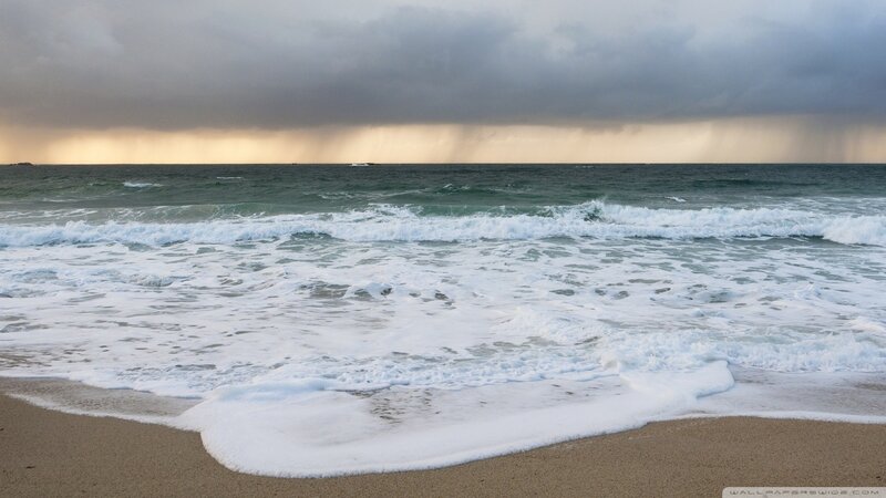 Stormy waves on a sandy beach