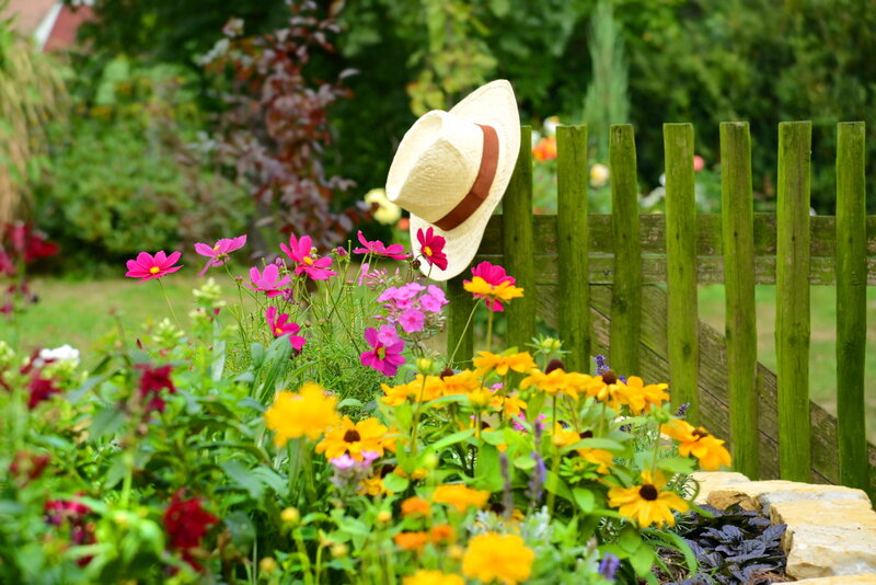 Straw Hat on Garden Fence