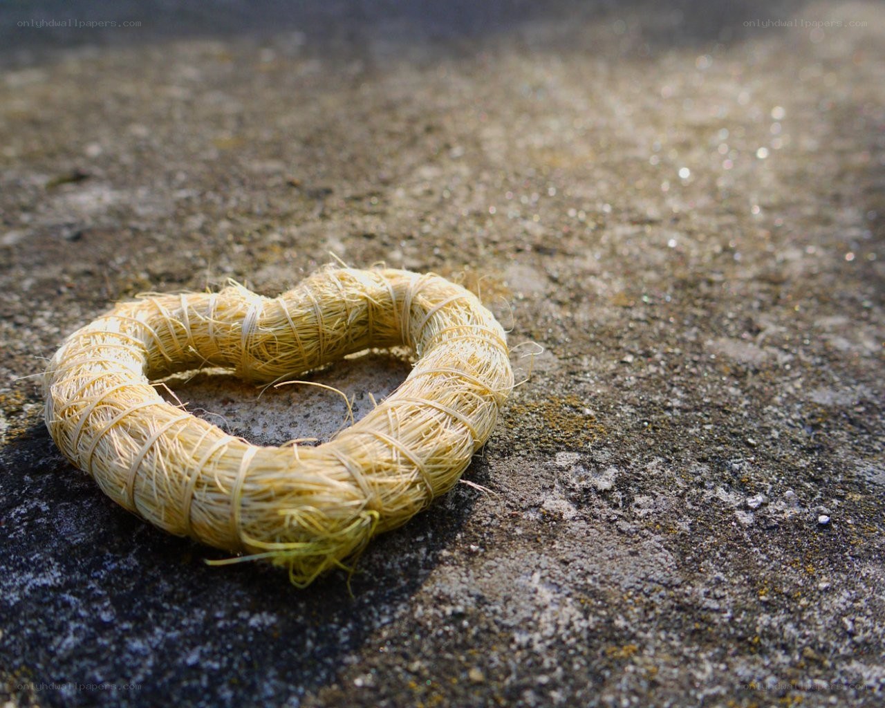 Straw heart on concrete