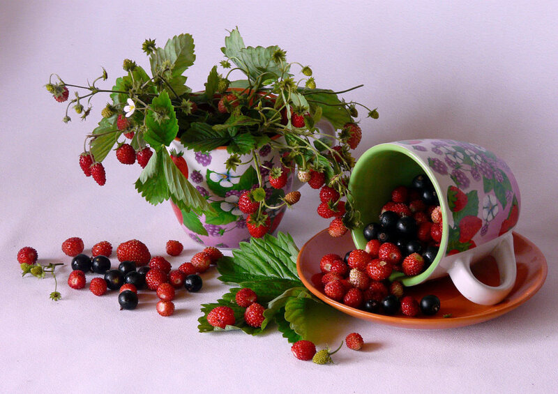strawberries and berries in cups