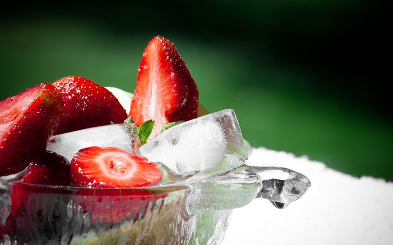 strawberries and ice in a glass