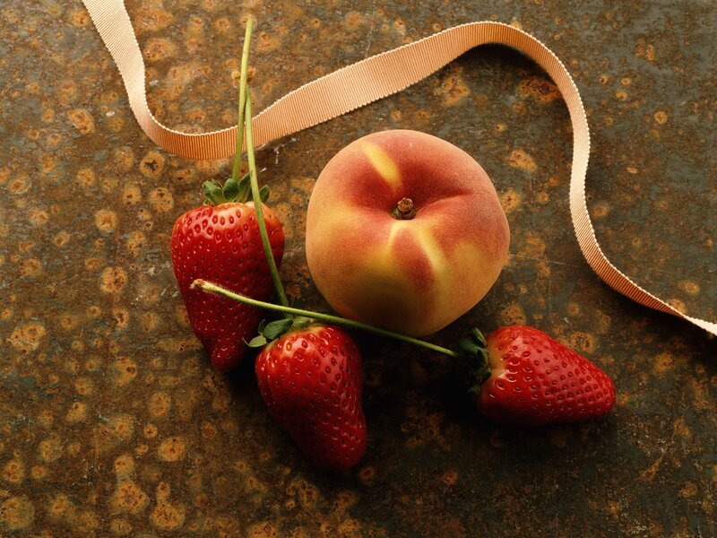 strawberries and peach on metal