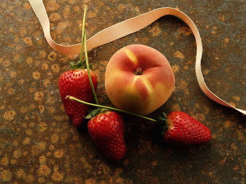 strawberries and peach on metal