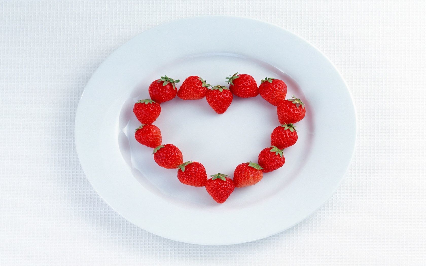 strawberries arranged in a heart