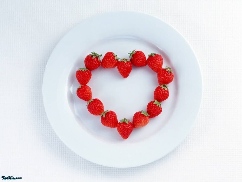 strawberries arranged in a heart