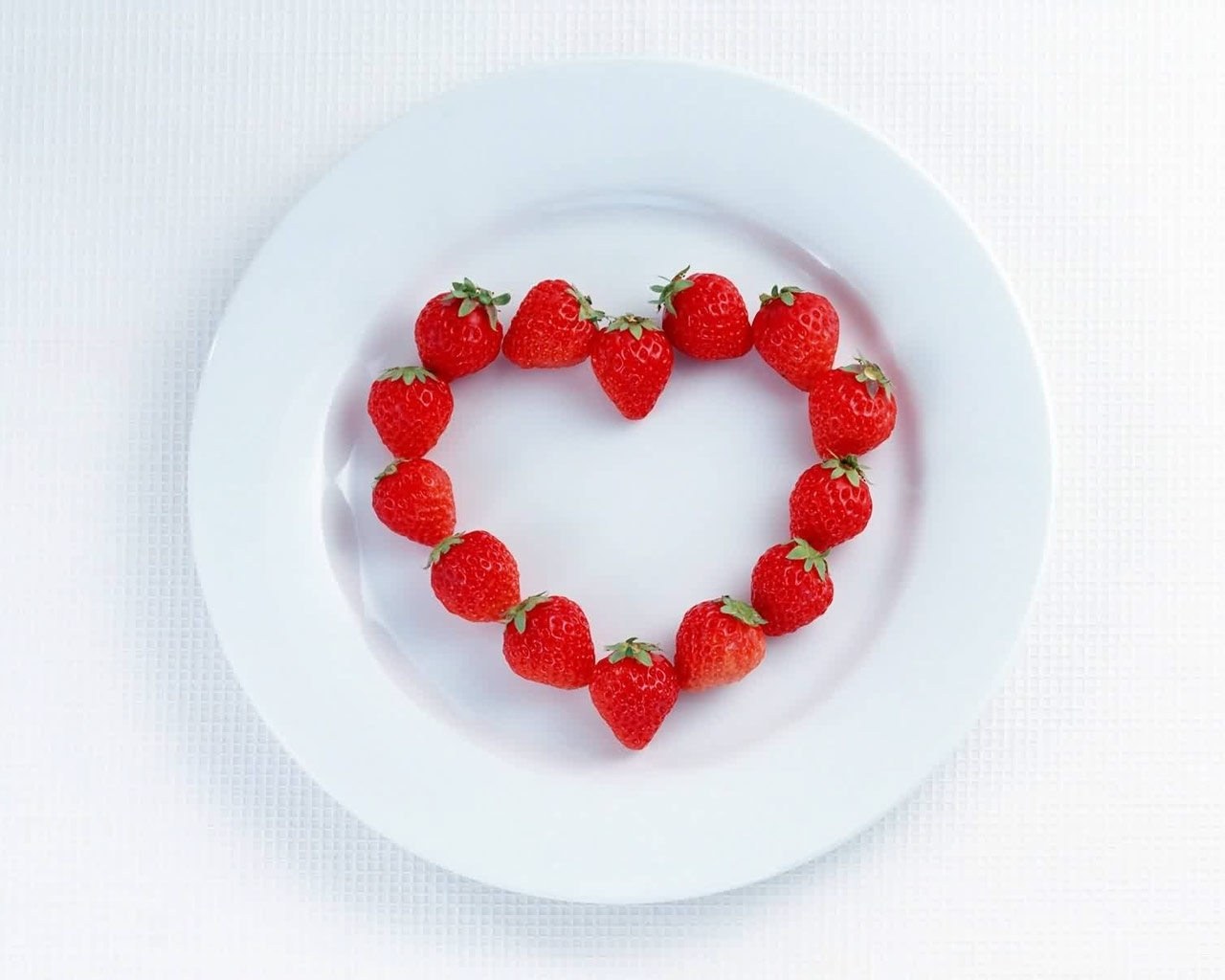 strawberries arranged in heart shape