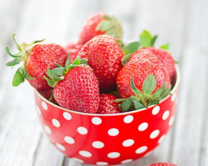 Strawberries in a Bowl — Red, Fresh, Photograph, Wooden Surface, Green Leaves