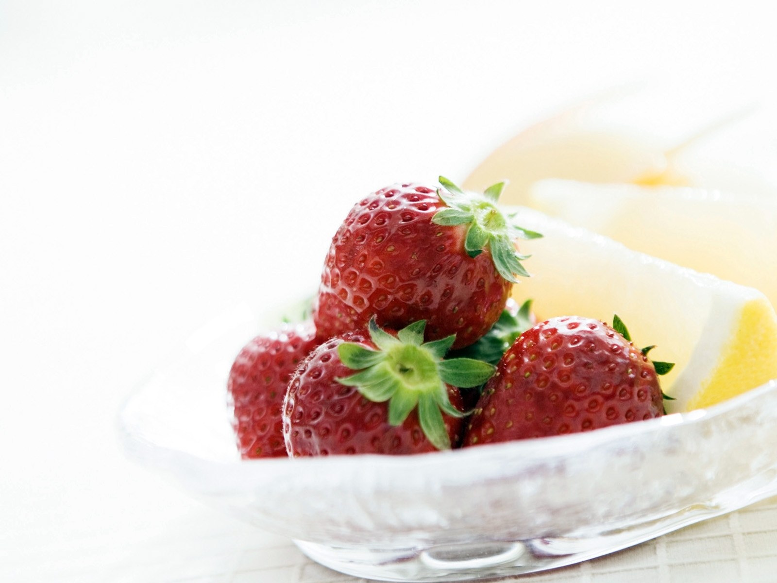 strawberries in a glass bowl