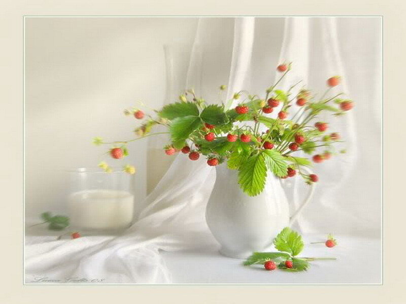 strawberries in a white pitcher