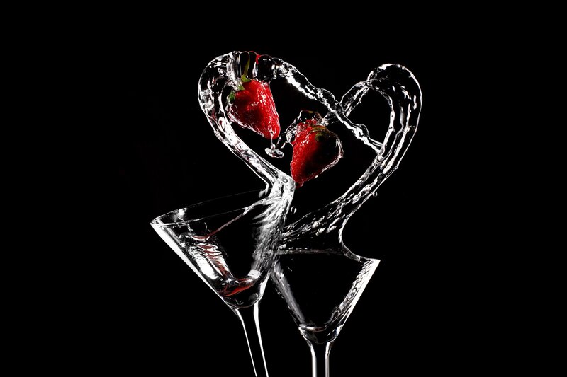 strawberries in heart-shaped water splash