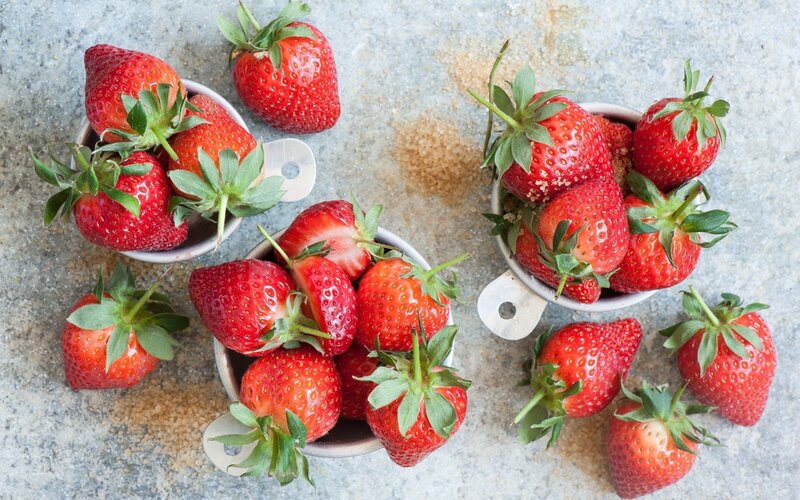Strawberries in Measuring Cups