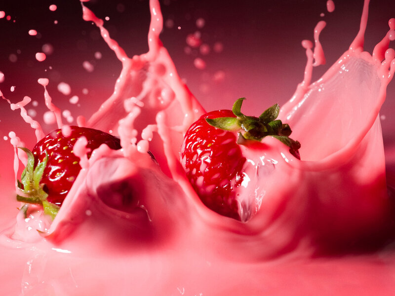 Strawberries in Pink Liquid — Dynamic, Photograph