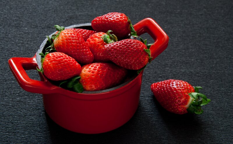 Strawberries in Red Pot — Dramatic, Photograph