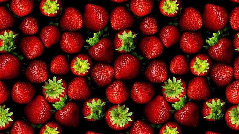 strawberries on black background