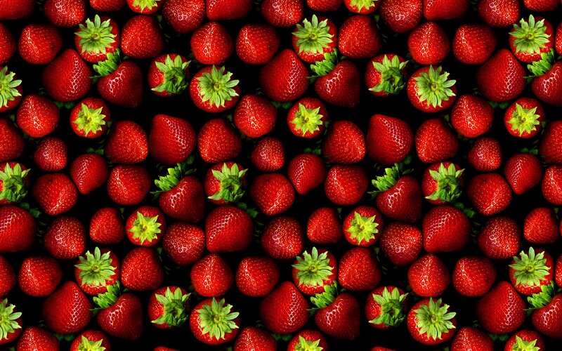 strawberries on black background
