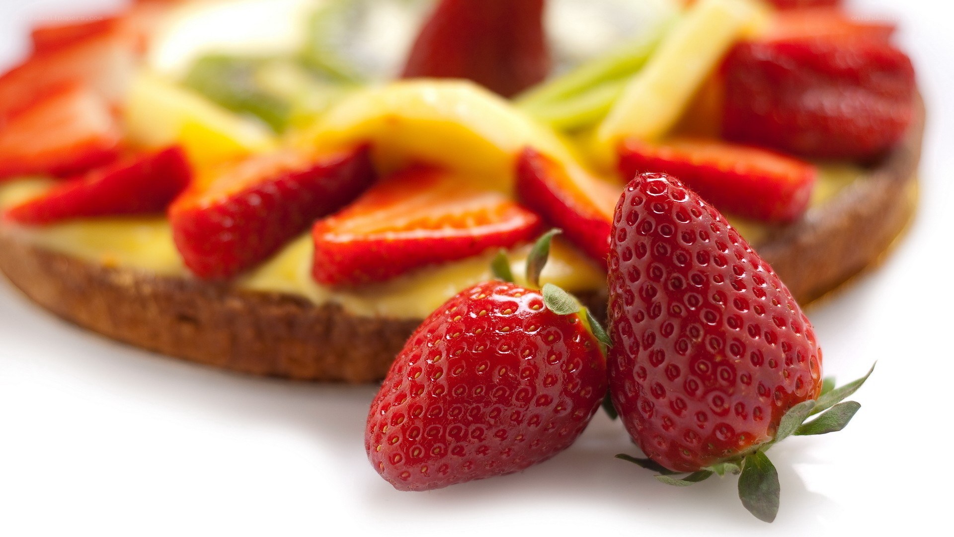 strawberries on fruit tart