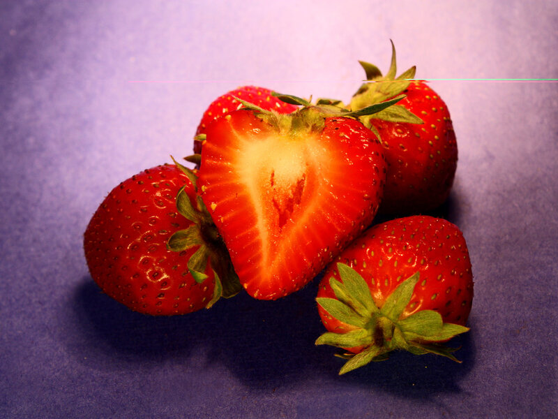 Strawberries on Purple Surface