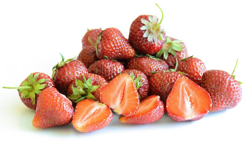 Strawberries on White Surface — Red