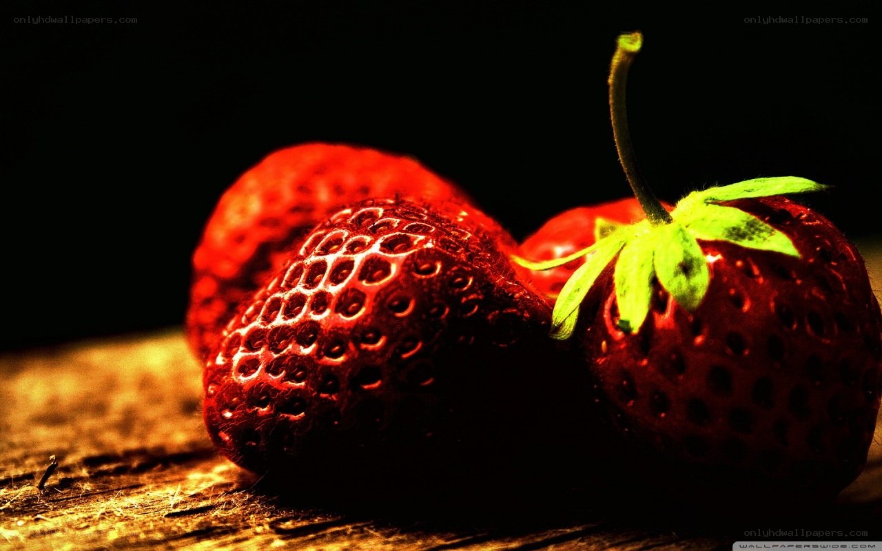 strawberries on wooden surface