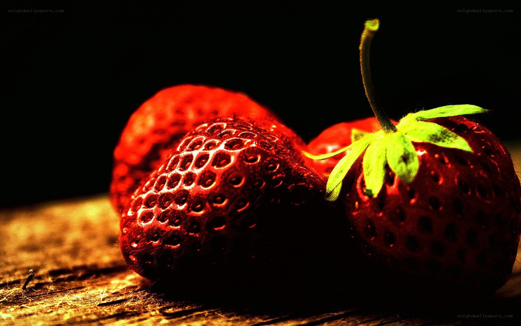 strawberries on wooden surface