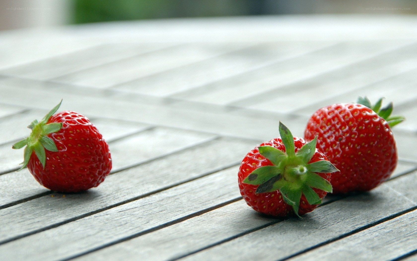strawberries on wooden table