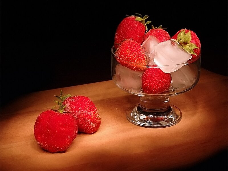 Strawberries with ice in a glass