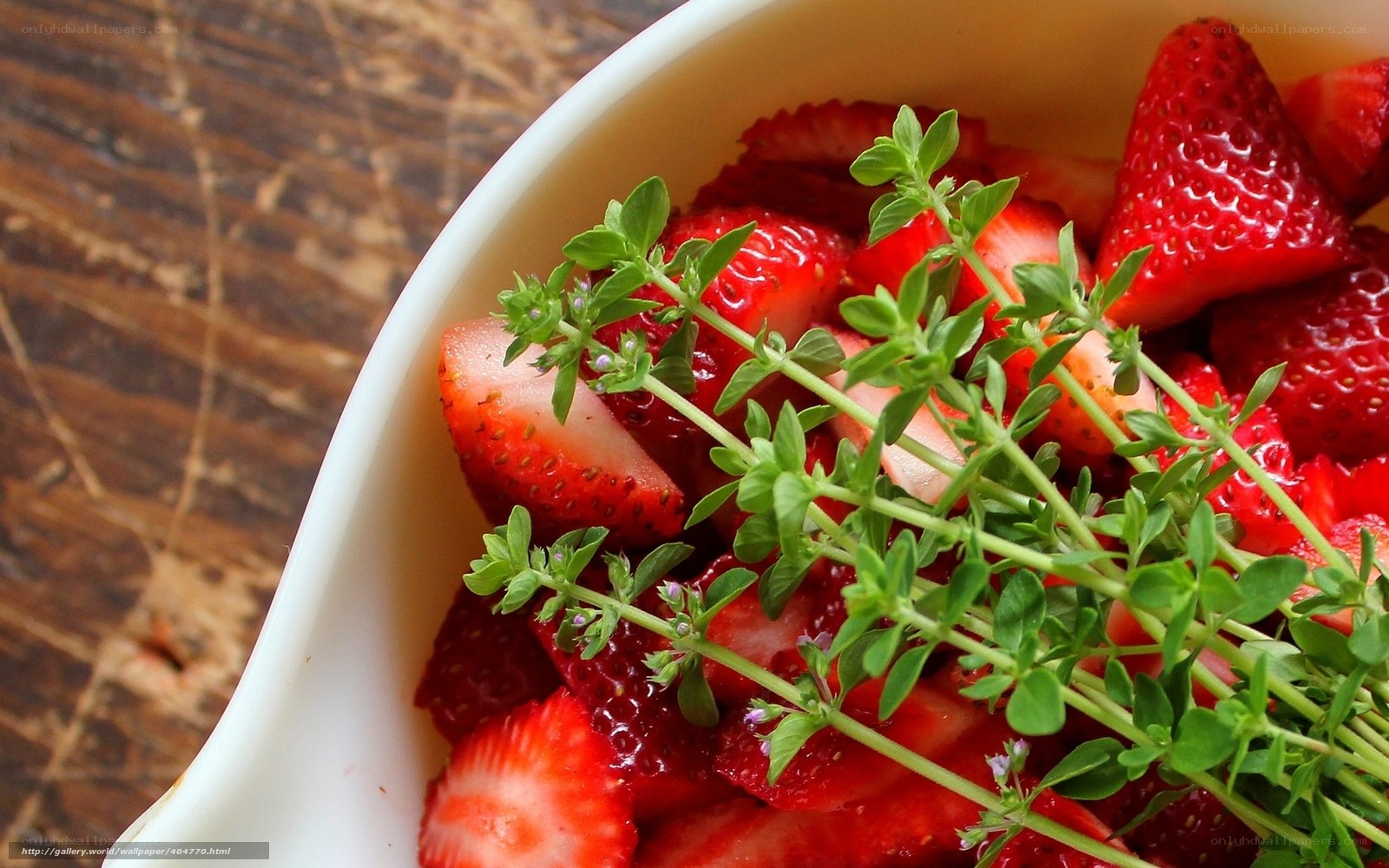 strawberries with thyme in bowl