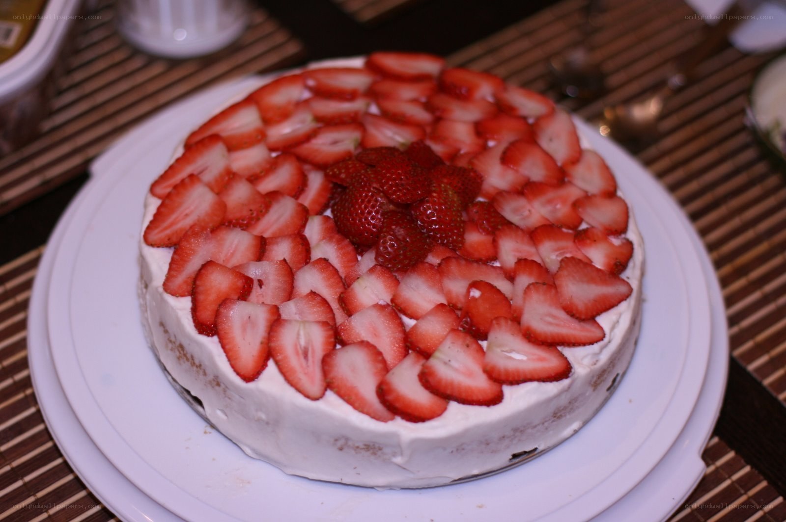 strawberry cake on white plate